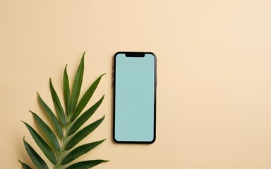 Minimal Flatlay of Modern Smartphone with Tropical Leaves on Beige Background. High quality
