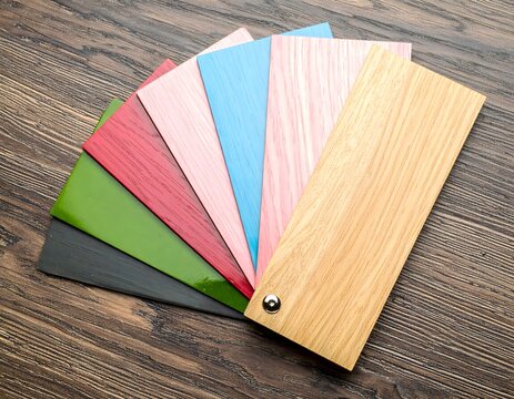 Colorful Wood Swatches Fanned Out on Wooden Surface.