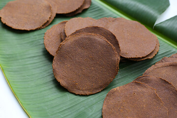 Fermented soybean discs, known as “Thua Nao,” a traditional Thai seasoning used to enhance flavor in Northern cuisine.