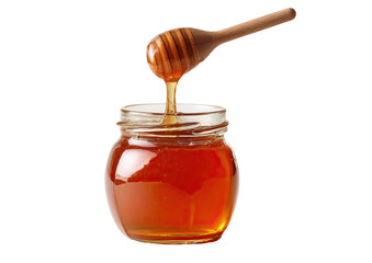 Honey poured from a wooden dipper into a glass jar