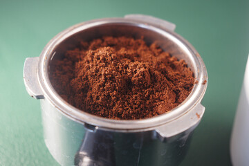 Ground coffee ready for brewing in a metal container