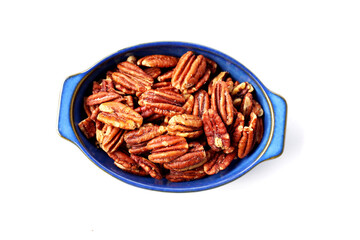 Delicious salted pecan nuts scattered.