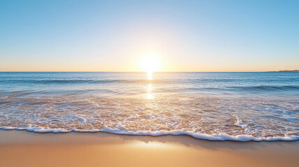 Obraz premium Sunset over calm ocean waves gently lapping on sandy beach, creating serene atmosphere