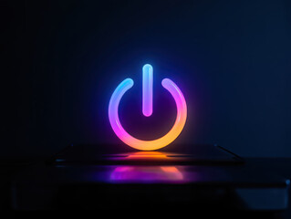 A glowing neon power button symbol in vibrant colors on a dark background