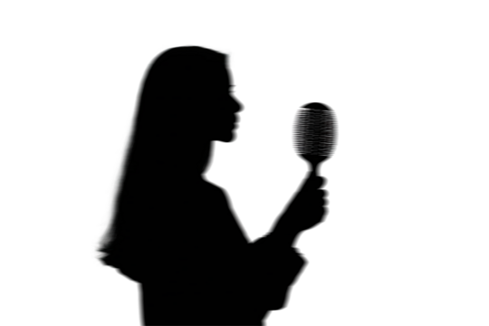 Silhouette of a person singing or speaking into a microphone