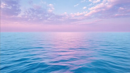 Obraz premium Serene ocean horizon with pastel pink and blue sky reflecting on the calm water surface, creating a peaceful and tranquil natural landscape