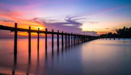 Obraz premium Sunset over wooden pier