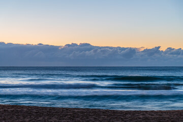 Fototapeta premium Sunrise by the sea shore