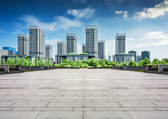 Bright Urban Landscape Featuring Modern High-Rise Buildings and Lush Greenery
