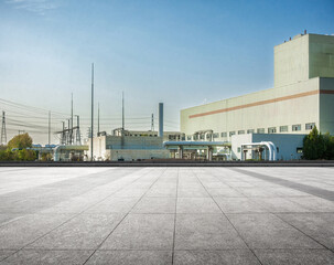 Modern Industrial Facility with Clear Blue Sky and Expansive Space