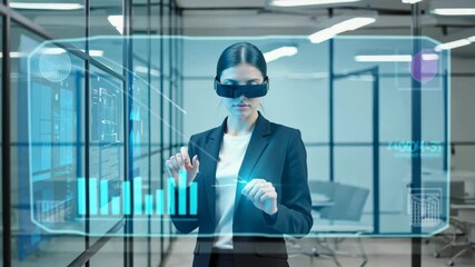 Businesswoman in AR glasses interacting with holographic data interface in modern office. Future technology, analytics, virtual screen. - Powered by Adobe