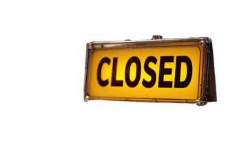 Illuminated yellow sign displaying the word "CLOSED