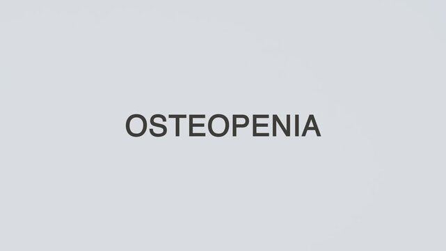 Osteopenia word diagnosed with hand holding stethoscope on white background, illustrating low bone density, skeletal weakness, medical diagnosis, and healthcare awareness