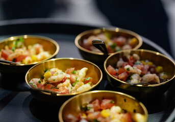 Elegant shrimp cocktail served in small bowls with vibrant toppings
