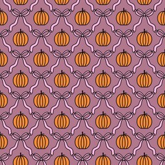 Fototapeta premium Seamless Halloween pattern with orange pumpkins and black ribbon bows on pink background, great for festive wallpapers, party decor, fabric, and seasonal designs.
