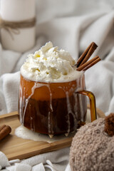 Autumn hygge Orange Cup of warm coffee autumn leaves on table against raindrops are running down the glass in window. Cozy fall still life footage burning candles. Thanksgiving and Halloween holiday