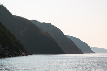 Serene Mountain Reflections Over Calm Waters at Dusk in Natural Landscape