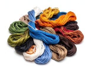 A vibrant collection of colorful embroidery floss skeins tangled in a pile, isolated on a white background for crafting.