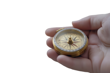 Hand holding brass compass for navigation
