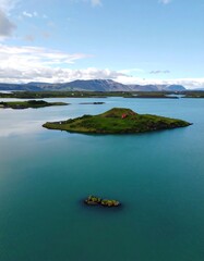 Tranquil island scene on a vibrant lake