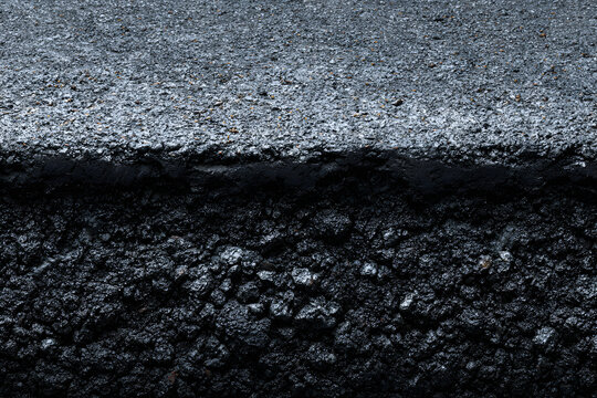 Real asphalt texture background. Coloured dark black asphalt pattern. Grainy street detail gray textured background. Best way show your design or illustration with this actual asphault photo texture.