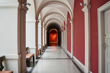 Fototapeta premium Interior view of classic building with white arches and columns. Concept of culture, architecture and history