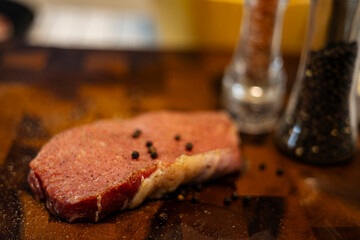 Fresh Raw Beef Steak With Rub On The Wood Board