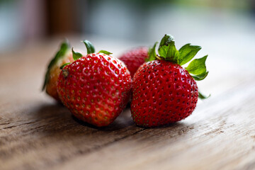 Fresh Strawberry Resting On Wooden Table