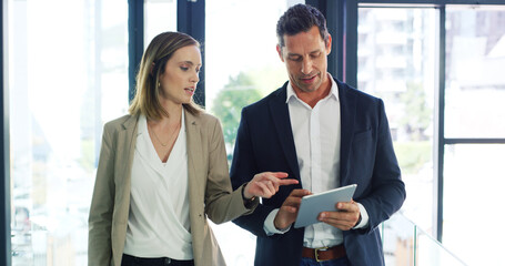 Businessman, woman and talk with tablet, review and discussion with risk management app at company. People, team and tech with perspective, feedback and point with collaboration at insurance agency