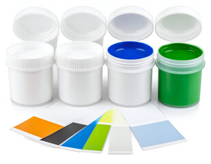 Vibrant artistic paints in white containers, with open caps showing blue and green, accompanied by painted color swatches on paper strips, isolated on a clean white background.