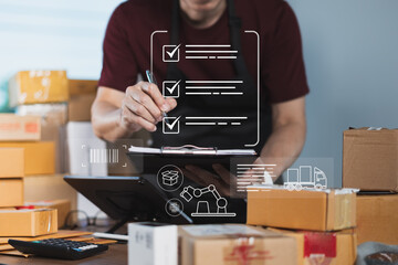 Small business owner checking product packing checklist with digital logistics workflow icons for...