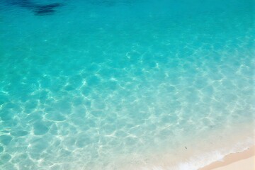 Clear blue water, shallow waves, sunny beach.