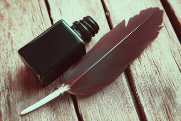 Retro ink bottle and feather quill