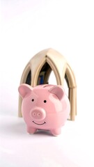 Pink piggy bank sits under miniature arched structure