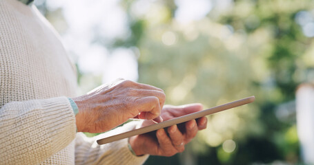 Man, hands and tablet with research outdoor for retirement information, email or reading online news. Senior person, digital tech and scrolling at park for social media update and download mobile app