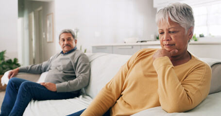 Argument, fight and senior couple on sofa for divorce, conflict and marriage crisis in home. Retirement, relationship and mature man and woman ignore for disagreement, frustrated and breakup in house