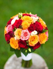 Vibrant round bouquet of various colored roses