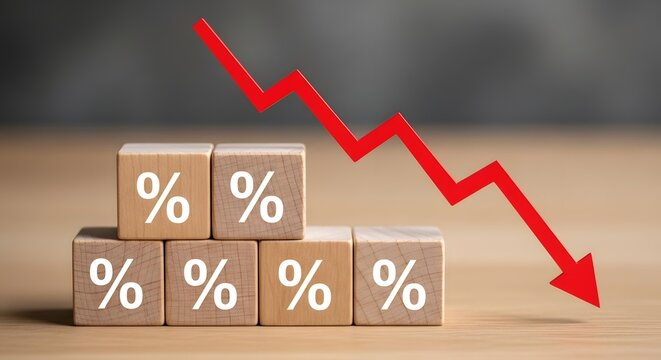 Wooden blocks with percentage signs and a red downward arrow indicating a decrease or loss trend