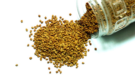 fenugreek seeds or methi dana isolated on white background