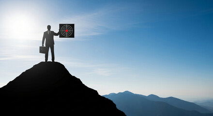 Silhouette of a Black man holding a target on top of a mountain at sunrise – silhouette of a determined Black man aiming