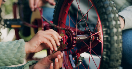 Hands, bike repair and help at park with safety inspection, wheel or chain for ride in summer. People, bicycle and maintenance with gear, outdoor or learning with support for sustainable transport