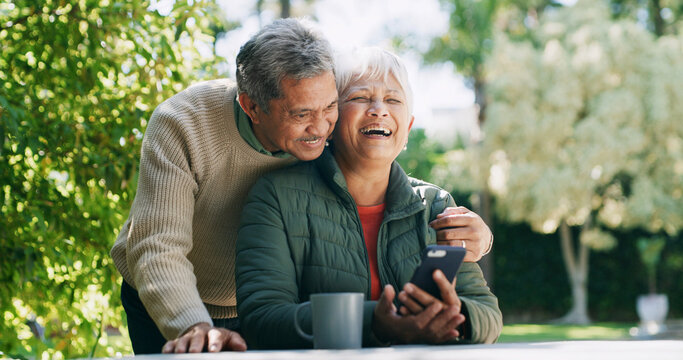 Backyard, laughing and senior couple with phone for funny conversation, bonding and relax outdoor Retirement home, garden and mature man and woman on smartphone for internet, connection and website