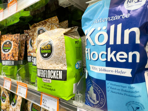 Villach, Austria - August 18, 2025: Hoch Genuss oatmeal and Kolln flakes packaging displayed on supermarket shelf, showcasing healthy breakfast options with vibrant colors and appealing design