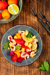 Plate of shrimp fruits salad.