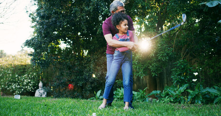 Golf, teaching and grandfather with kid in nature for swing, target practice and support together. Sports prodigy, learning and game mentor with old man and girl in backyard of home for put and hobby