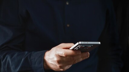 Close-up of male hand holding modern smartphone for online banking and crypto payments. Showcases mobile financial apps and digital transaction convenience. - Powered by Adobe