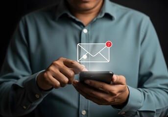 Man checking new email notifications on his smartphone with an envelope icon and a red notification