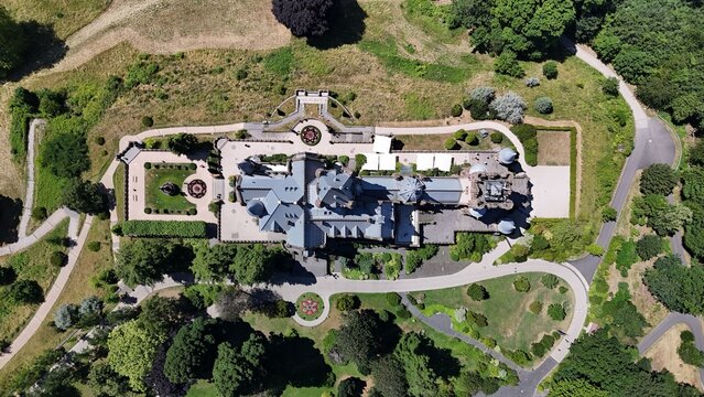 Aerial view of historic mansion and gardens.
