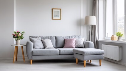 Fototapeta premium Cozy living room with grey sofa and floral arrangement