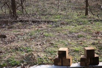 Stacked Wooden Blocks on Grass Field